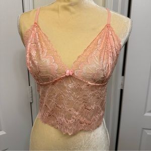 baby pale pink lace tank top with bow detailing in the middle